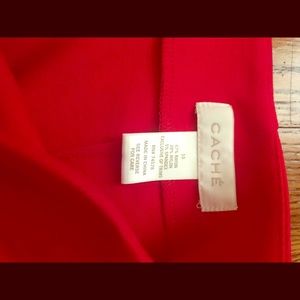 Long red skirt with gold zipper in back